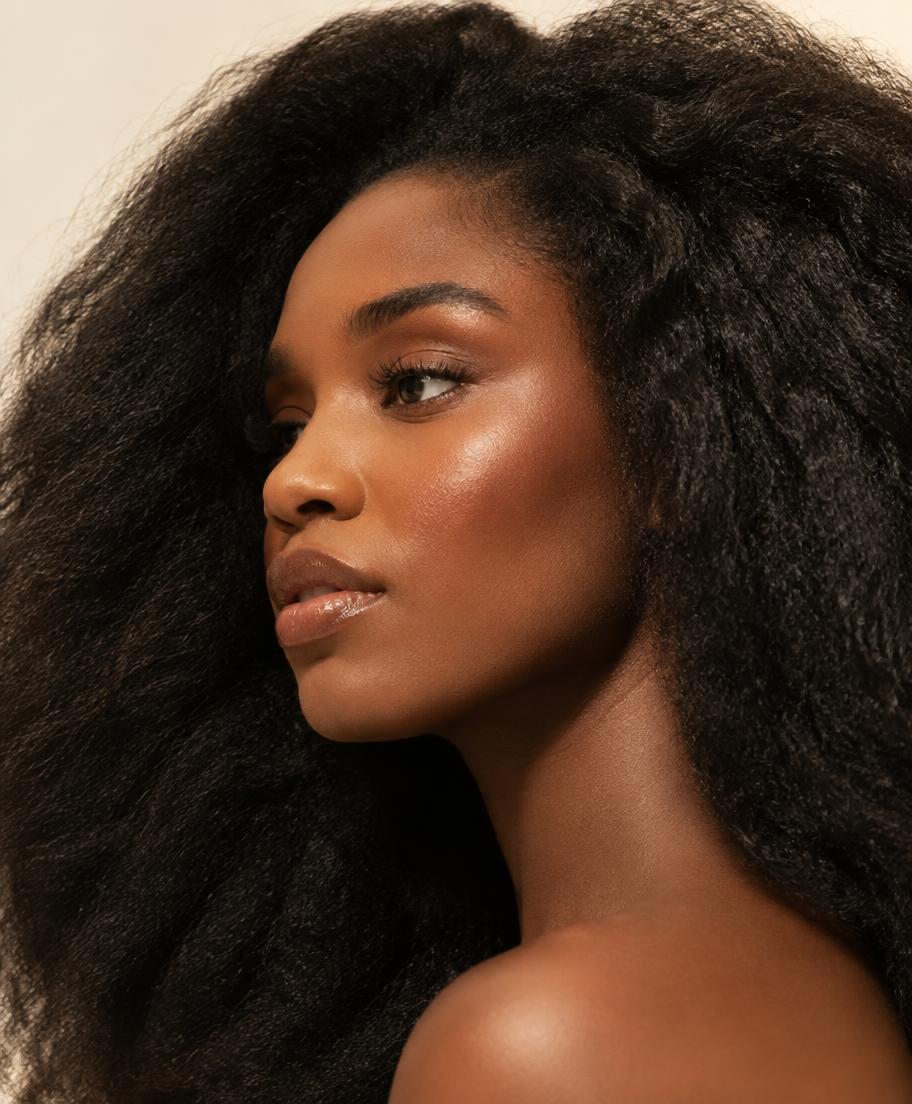 Illustrative portrait of a woman with voluminous textured dark hair, looking to the side.
